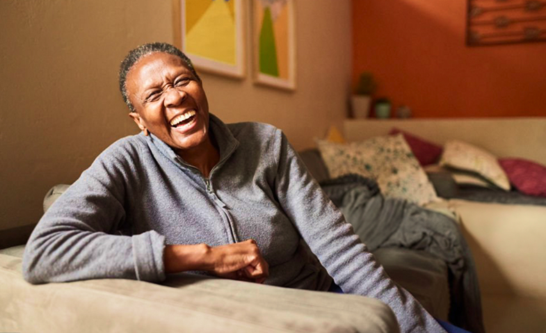Elderly person laughing with joy