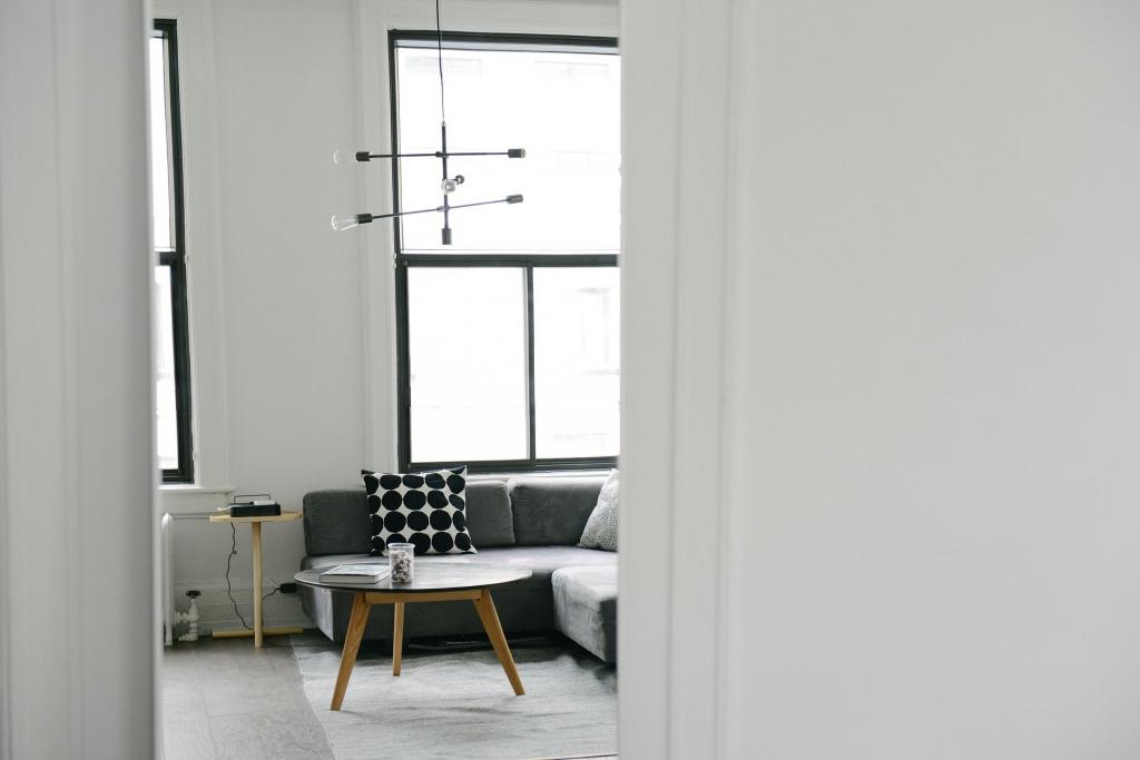 Modern monochrome living setting with large window