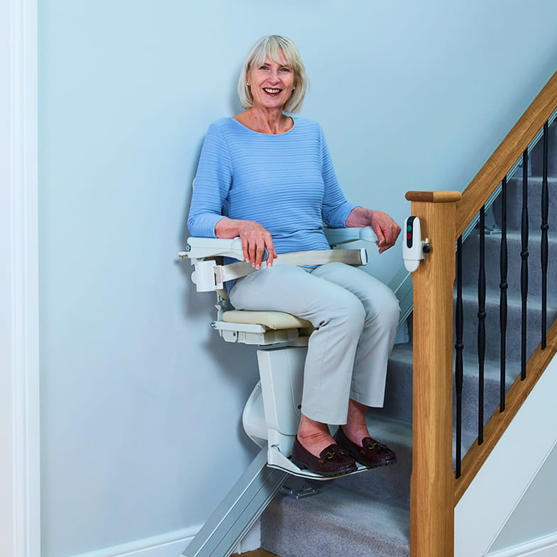 lovely elderly woman on a stairlift