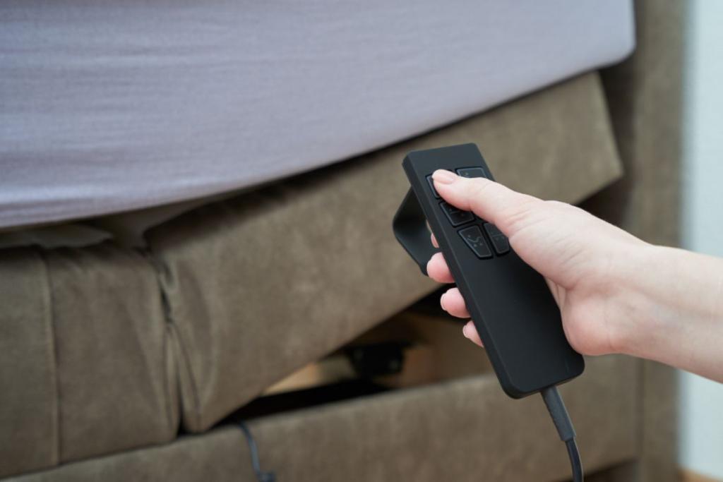 Womens hand using remote. control