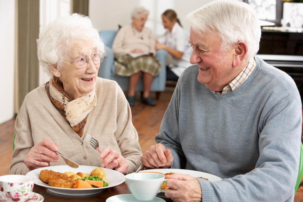 Old couple eating a meal together